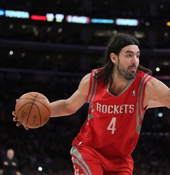 LOS ANGELES, CA - FEBRUARY 01:  Luis Scola #4 of the Houston Rockets is defended by Pau Gasol #16 of the Los Angeles Lakers in the second half at Staples Center on February 1, 2011 in Los Angeles, California. The Lakers defeated the Rockets 114-106. NOTE 