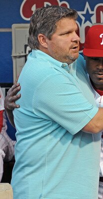 PHILADELPHIA - APRIL 17: Jimmy Rollins #11 of the Philadelphia Phillies hugs former player John Kruk during a tribute to recently departed Philadelphia Phillies announcer Harry Kalas before the game against the San Diego Padres on April 17, 2009 at Citize