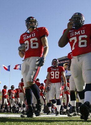 DALLAS - NOVEMBER 29:  Members of the Southern Methodist University Mustangs cheer the start of the second half against the Texas Christian University Horned Frogs despite looking at an 0-11 season November 29, 2003 at Gerald J. Ford Stadium in Dallas, Te