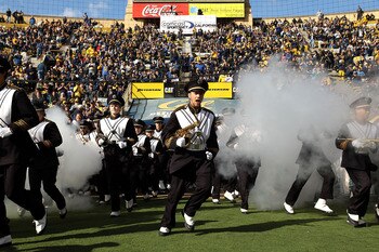 BERKELEY, CA - NOVEMBER 20:  Members of the California Golden Bears marching band run on to the field for their game against the Stanford Cardinal at California Memorial Stadium on November 20, 2010 in Berkeley, California.  (Photo by Ezra Shaw/Getty Imag