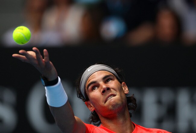 MELBOURNE, AUSTRALIA - JANUARY 18:  Rafael Nadal of Spain serves in his first round match against Marcos Daniel of Brazil during day two of the 2011 Australian Open at Melbourne Park on January 18, 2011 in Melbourne, Australia.  (Photo by Lucas Dawson/Get