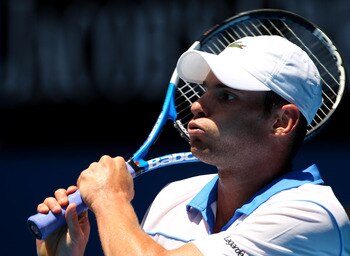 MELBOURNE, AUSTRALIA - JANUARY 21:  Andy Roddick of the United States of America plays a backhand in his third round match against Robin Haase of the Netherlands during day five of the 2011 Australian Open at Melbourne Park on January 21, 2011 in Melbourn