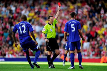 LONDON, ENGLAND - SEPTEMBER 11:  Referee Stuart Attwell shows Gary Cahill of Bolton a red card during the Barclays Premier League match between Arsenal and Bolton Wanderers at The Emirates Stadium on September 11, 2010 in London, England.  (Photo by Jamie