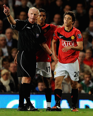 MANCHESTER, ENGLAND - SEPTEMBER 23: Fabio Da Silva of Manchester United is sent off by Referee Peter Walton during the Carling Cup Third Round match between Manchester United and Wolverhampton Wanderers at Old Trafford on September 23, 2009 in Manchester,