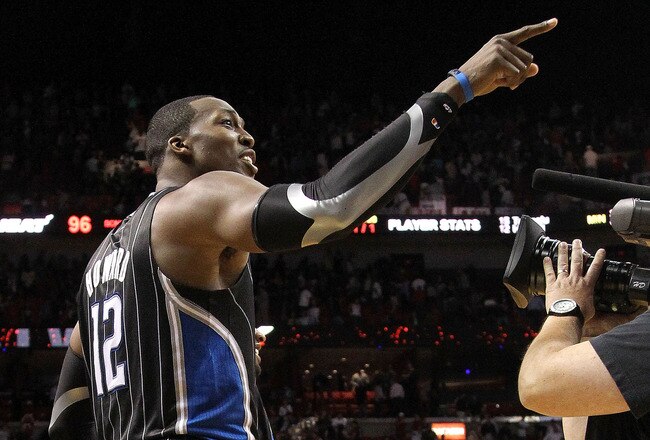 MIAMI, FL - MARCH 03:  Dwight Howard #12 of the Orlando Magic points to a heckler after winning a game against the Miami Heat at American Airlines Arena on March 3, 2011 in Miami, Florida. NOTE TO USER: User expressly acknowledges and agrees that, by down