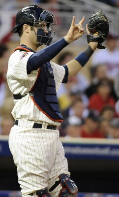MINNEAPOLIS, MN - OCTOBER 7: Joe Mauer #7 of the Minnesota Twins gives signs during game two of the ALDS game against the New York Yankees on October 7, 2010 at Target Field in Minneapolis, Minnesota.  (Photo by Hannah Foslien/Getty Images)