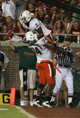 TALLAHASSEE, FL - SEPTEMBER 07:  Running Graig Cooper #2 of the Miami Hurricanes celebrates his 24 yard touchdown pass with offensive lineman Orlando Franklin #74 in the fourth quarter against the Florida State Seminoles at Doak Campbell Stadium on Septem