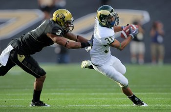 BOULDER, CO - SEPTEMBER 06:  Wide receiver Dion Morton #31 of the Colorado State Ramsmakes a reception as cornerback Jimmy Smith #3 of the Colorado Buffaloes defends at Folsom Field on September 6, 2009 in Boulder, Colorado. The Rams defeated the Buffaloe