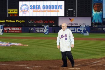 NEW YORK - SEPTEMBER 28:  Former New York Mets players Yogi Berra waves to the fans at home plate after the game against the Florida Marlins to commemorate the last regular season baseball game ever played in Shea Stadium on September 28, 2008 in the Flus