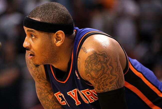 MIAMI, FL - FEBRUARY 27:  Carmelo Anthony #7 of the New York Knicks looks on during a foul shot during a game gainst the Miami Heat at American Airlines Arena on February 27, 2011 in Miami, Florida. NOTE TO USER: User expressly acknowledges and agrees tha