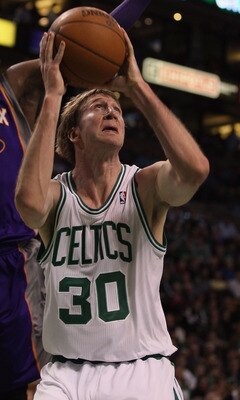 BOSTON, MA - MARCH 02:  Troy Murphy #30 of the Boston Celtics takes a shot as Mickael Pietrus #12 of the Phoenix Suns defends on March 2, 2011 at the TD Garden in Boston, Massachusetts.  NOTE TO USER: User expressly acknowledges and agrees that, by downlo