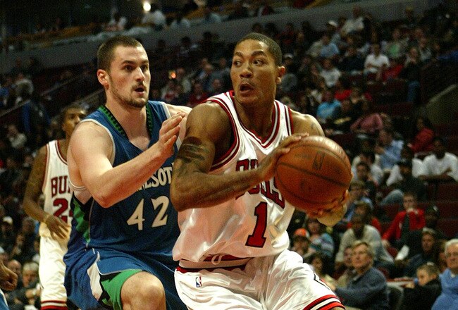 CHICAGO - OCTOBER 14:  Derrick Rose #1 of the Chicago Bulls drives against Kevin Love #42 of the Minnesota Timberwolves during their NBA preseson game at the United Center on October 14, 2008 in Chicago, Illinois. NOTE TO USER: User expressly acknowledges