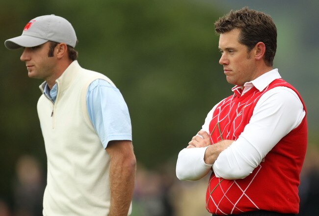 NEWPORT, WALES - OCTOBER 01:  Dustin Johnson (L) of the USA and Lee Westwood of Europe look on during the Morning Fourball Matches during the 2010 Ryder Cup at the Celtic Manor Resort on October 1, 2010 in Newport, Wales. (Photo by Ross Kinnaird/Getty Ima
