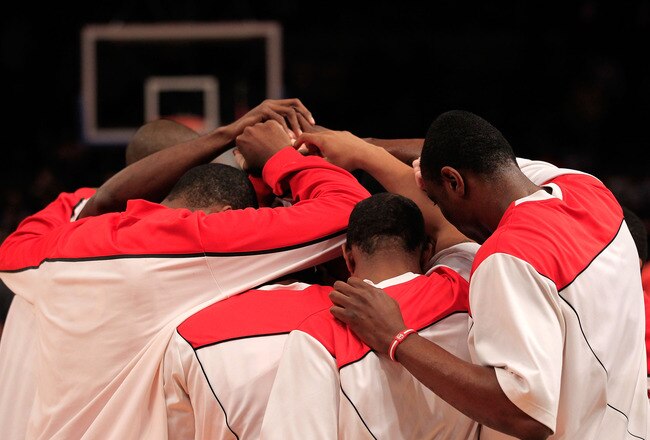 NEW YORK, NY - MARCH 10: The St. John's Red Storm huddles before their game against the Syracuse Orange during the quarterfinals of the 2011 Big East Men's Basketball Tournament presented by American Eagle Outfitters  at Madison Square Garden on March 10,