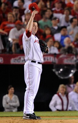 ANAHEIM, CA - OCTOBER 22:  John Lackey #41 of the Los Angeles Angels of Anaheim adjusts his cap during the seventh inning in Game Five of the ALCS against the New York Yankees during the 2009 MLB Playoffs at Angel Stadium on October 22, 2009 in Anaheim, C