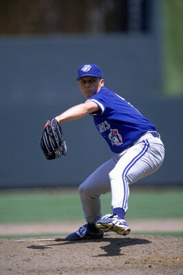 KANSAS CITY - JUNE 11:  David Cone #11 of the Toronto Blue Jays winds up for a pitch during a game against the Kansas City Royals during a game at Kauffman Stadium on June 11, 1995 in Kansas City, Missouri.  The Roylas won 2-1.  (Photo by Stephen Dunn/Get