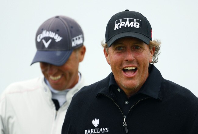 SANDWICH, ENGLAND - JULY 13:  Phil Mickelson (R) of the USA enjoys a joke during the final practice round during The Open Championship at Royal St. George's on July 13, 2011 in Sandwich, England. The 140th Open begins on July 14, 2011..  (Photo by Richard