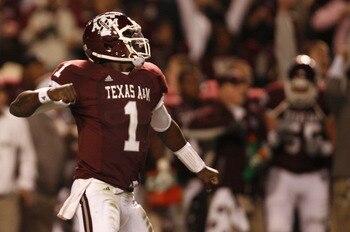 COLLEGE STATION, TX - NOVEMBER 26: Quarterback Jerrod Johnson #1 of the Texas A&M Aggies celebrates after throwing a touchdown pass against the Texas Longhorns in the first half at Kyle Field on November 26, 2009 in College Station, Texas. (Photo by Aaron
