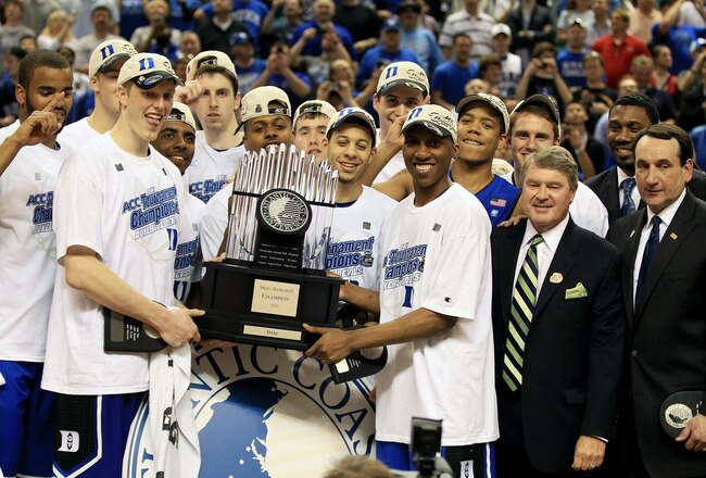 GREENSBORO, NC - MARCH 13:  The Duke Blue Devils celebrate with the ACC Championship Trophy after their 75-58 victory over the North Carolina Tar Heels in the championship game of the 2011 ACC men's basketball tournament at the Greensboro Coliseum on Marc