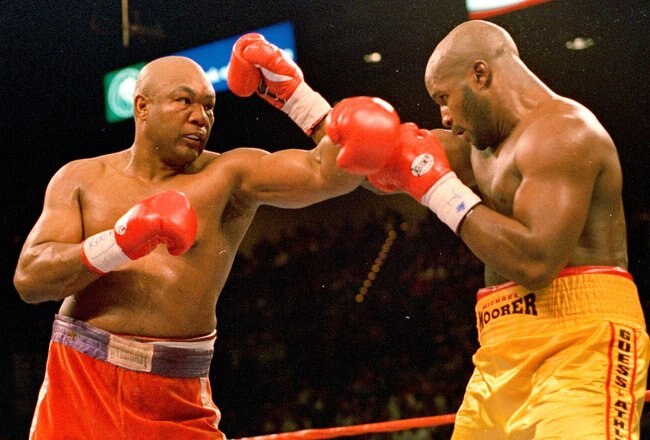 5 Nov 1995:  George Foreman trows a left punch at Michael Moorer during the fight in Las Vegas. Forman wins by a knock out in round 10. Mandatory Credit: Al Bello  /Allsport