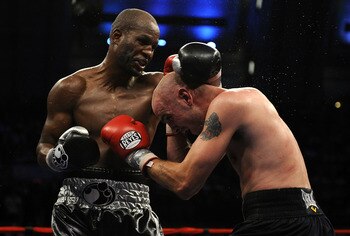 ATLANTIC CITY, NJ - OCTOBER 18:  Bernard Hopkins of Philadelphia,  Pennsylvania (L) connects to Kelly Pavlik of Youngstown, Ohio during their light heavyweight bout at Boardwalk Hall on October 18, 2008 in Atlantic City, New Jersey.  (Photo by Jeff Zeleva