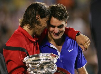 MELBOURNE, AUSTRALIA - FEBRUARY 01:  Rafael Nadal of Spain consoles Roger Federer of Switzerland during the trophy presentation after his men's final match during day fourteen of the 2009 Australian Open at Melbourne Park on  February 1, 2009 in Melbourne
