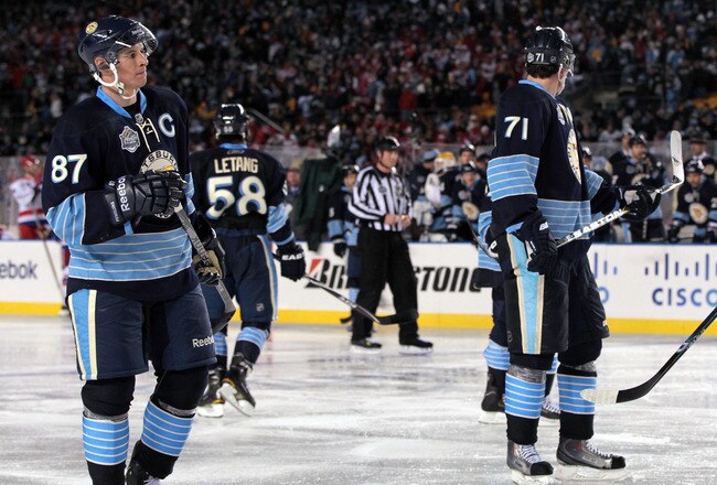 PITTSBURGH, PA - JANUARY 01:  Alex Ovechkin #8 of the Washington Capitals exchanges glances with Sidney Crosby #81 of the Pittsburgh Penguins during the 2011 NHL Bridgestone Winter Classic at Heinz Field on January 1, 2011 in Pittsburgh, Pennsylvania. Was