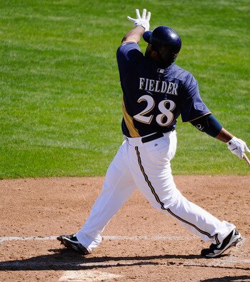PHOENIX, AZ - MARCH 10:  Prince Fielder#28 of the Milwaukee Brewers hits a base hit against the Colorado Rockies in the third inning of the spring training baseball game at Maryvale Baseball Park on March 10, 2011 in Phoenix, Arizona.  (Photo by Kevork Dj