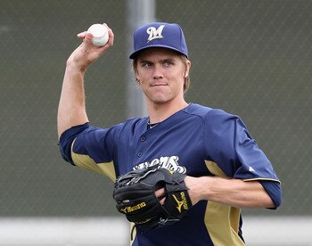 PHOENIX, AZ - FEBRUARY 18:  Pitcher Zack Greinke #13 of the Milwaukee Brewers participates in fielding drills during a MLB spring training practice at Maryvale Baseball Park on February 18, 2011 in Phoenix, Arizona.  (Photo by Christian Petersen/Getty Ima