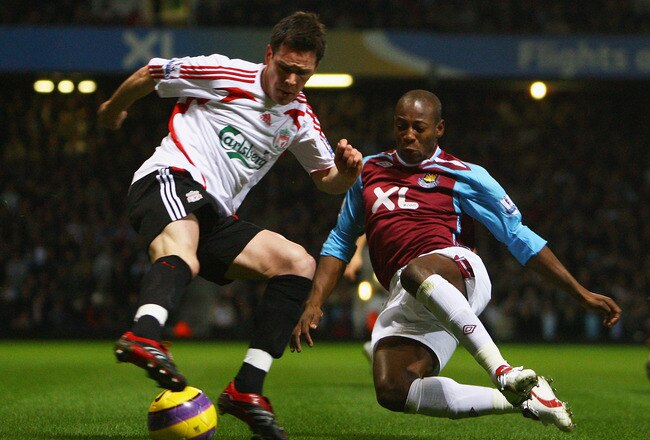LONDON - JANUARY 30:  Steve Finnan of Liverpool is challenged by Luis Boa Morte of West Ham during the Barclays Premier League match between West Ham United and Liverpool at Upton Park on January 30, 2008 in London, England.  (Photo by Julian Finney/Getty