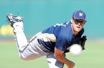 GOODYEAR, AZ - MARCH 11: Mark Rogers #64 of the Milwaukee Brewers pitches during a Spring Training game against the Cincinnati Reds on March 11, 2010 at Goodyear Ballpark in Goodyear, Arizona. (Photo by Lisa Blumenfeld/Getty Images)