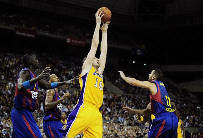 BARCELONA, SPAIN - OCTOBER 07:  Pau Gasol #16 of the Los Angeles Lakers (3rdL) fights for a rebound against Boniface Ndong #21 of the Regal FC Barcelona (L), Terence Morris #23 of the Regal FC Barcelona (2ndL) and Juan Carlos Navarro #11 of the Regal FC B
