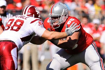 COLUMBUS, OH - OCTOBER 9:  Justin Boren #65 of the Ohio State Buckeyes blocks against the Indiana Hoosiers at Ohio Stadium on October 9, 2010 in Columbus, Ohio.  (Photo by Jamie Sabau/Getty Images)