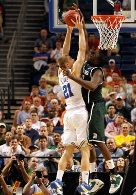 TAMPA, FL - MARCH 17:  Draymond Green #23 of the Michigan State Spartans blocks a shot attempt by Brendan Lane #21 of the UCLA Bruins in the second half during the second round of the 2011 NCAA men's basketball tournament at St. Pete Times Forum on March
