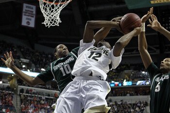 INDIANAPOLIS, IN - MARCH 11:  Delvon Roe #10 of the Michigan State Spartans defends in the first half against Kelsey Barlow #12 of the Purdue Boilermakers during the quarterfinals of the 2011 Big Ten Men's Basketball Tournament at Conseco Fieldhouse on Ma