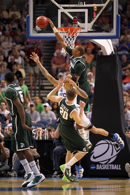 TAMPA, FL - MARCH 17:  Adreian Payne #5 of the Michigan State Spartans blocks a shot attempt in the first half by Tyler Honeycutt #23 of the UCLA Bruins during the second round of the 2011 NCAA men's basketball tournament at St. Pete Times Forum on March