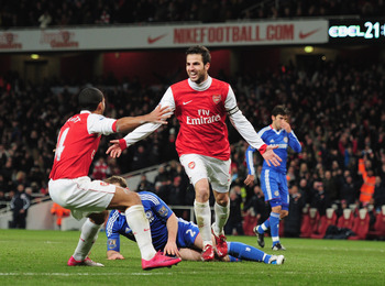 LONDON, ENGLAND - DECEMBER
27: Cesc Fabregas of Arsenal celebrates Arsenal's second goal with Theo
Walcott (L) during the Barclays Premier League match between Arsenal
and Chelsea at the Emirates Stadium on December 27, 2010 in London,
England. (Photo b
