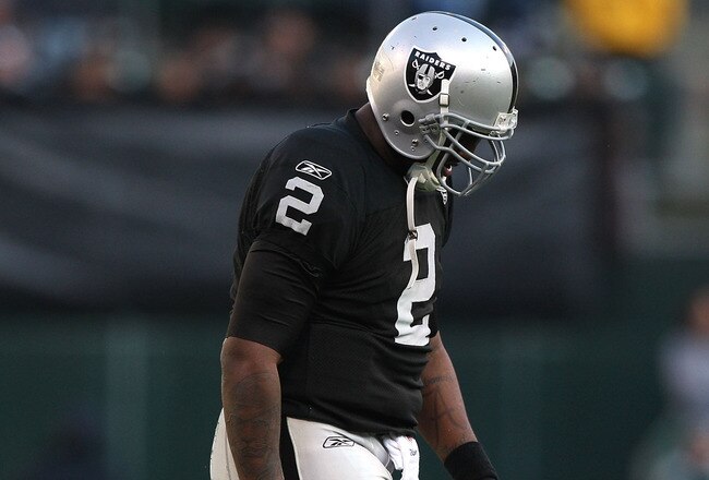 OAKLAND, CA - JANUARY 03:  JaMarcus Russell #2 of the Oakland Raiders walks off the field against the Baltimore Ravens during an NFL game at Oakland-Alameda County Coliseum on January 3, 2010 in Oakland, California.  (Photo by Jed Jacobsohn/Getty Images)