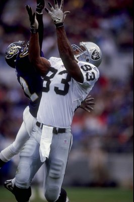 8 Nov 1998:  Tight end Rickey Dudley #83 of the Oakland Raiders in action against cornerback Duane Starks #22 of the Baltimore Ravens during a game at the NFL Stadium at Camden Yards in Baltimore, Maryland. The Ravens defeated the Raiders 13-10. Mandatory