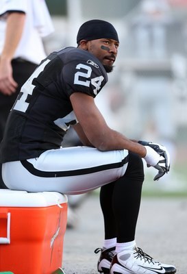 OAKLAND, CA - NOVEMBER 2:  Michael Huff #24 of the Oakland Raiders looks on from the bench area during the game against the the Atlanta Falcons on November 2, 2008 at the Oakland-Alameda County Coliseum in Oakland, California. The Falcons defeated the Rai