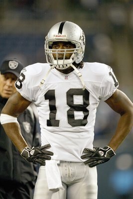 SEATTLE - NOVEMBER 6: Randy Moss #18 of the Oakland Raiders looks on during the game against the Seattle Seahawks at Qwest Field November 6, 2006 in Seattle, Washington. The Seahawks defeated the Raiders 16-0. (Photo by Otto Greule Jr/Getty Images)