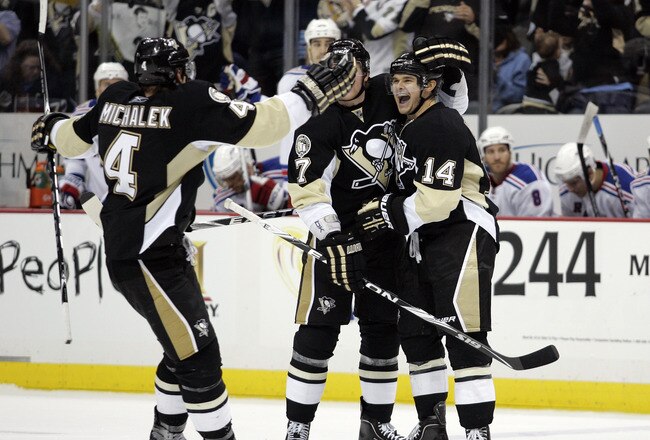 PITTSBURGH, PA - MARCH 20:  Chris Kunitz #14 of the Pittsburgh Penguins celebrates his short handed goal against the New York Rangers at Consol Energy Center on March 20, 2011 in Pittsburgh, Pennsylvania.  The Rangers defeated the Penguins 5-2.  (Photo by