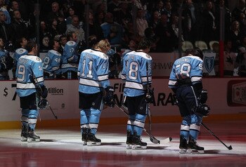 PITTSBURGH, PA - FEBRUARY 23:  (L-R) Pascal Dupuis #9, Jordan Staal #11, James Neal #18 and Kris Letang #58 of the Pittsburgh Penguins stand attended for the National Anthem before the NHL game against the San Jose Sharks at Consol Energy Center on Februa