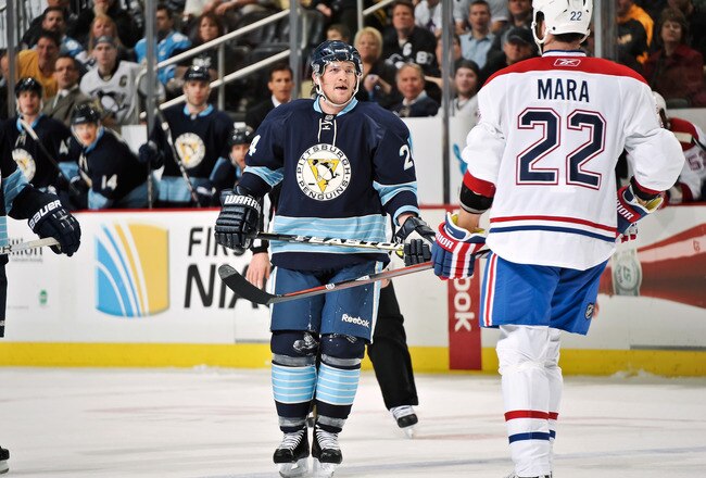 PITTSBURGH, PA - MARCH 12:  Matt Cooke #24 of the Pittsburgh Penguins exchanges words with Paul Mara #22 of the Montreal Canadiens on March 12, 2011 at CONSOL Energy Center in Pittsburgh, Pennsylvania.  (Photo by Jamie Sabau/Getty Images)