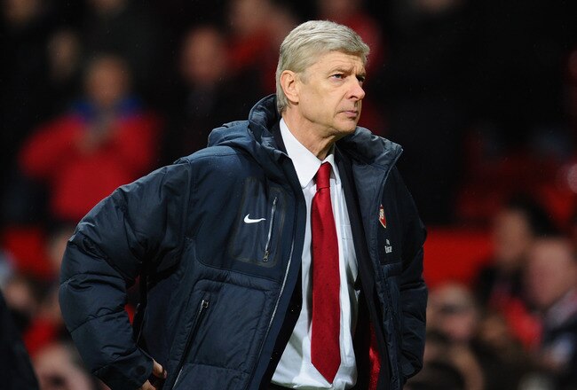 MANCHESTER, ENGLAND - MARCH 12:  Arsenal manager Arsene Wenger looks dejected after defeat in the FA Cup sponsored by E.On Sixth Round match between Manchester United and Arsenal at Old Trafford on March 12, 2011 in Manchester, England.  (Photo by Clive M