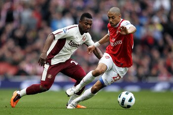 LONDON, ENGLAND - MARCH 05:  Stephane Sessegnon of Sunderland puts the pressure on Gael Clichy of Arsenal during the Barclays Premier League match between Arsenal and Sunderland at Emirates Stadium on March 5, 2011 in London, England.  (Photo by Paul Gilh