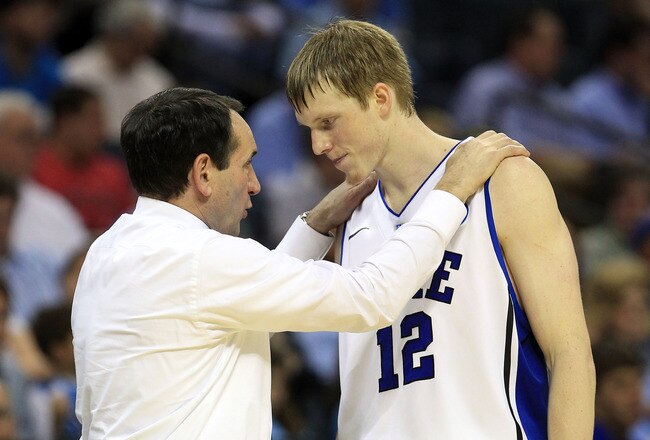 CHARLOTTE, NC - MARCH 20:  Head coach Mike Krzyzewski of the Duke Blue Devils talks with Kyle Singler #12 while taking on the Michigan Wolverines during the third round of the 2011 NCAA men's basketball tournament at Time Warner Cable Arena on March 20, 2