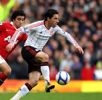 MANCHESTER, ENGLAND - JANUARY 09:  Rafael of Manchester United competes with Maxi Rodriguez of Liverpool during the FA Cup sponsored by E.ON 3rd round match between Manchester United and Liverpool at Old Trafford on January 9, 2011 in Manchester, England.