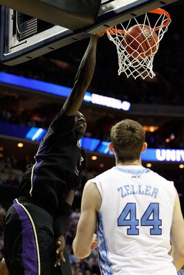 CHARLOTTE, NC - MARCH 20:  Aziz N'Diaye #5 of the Washington Huskies dunks the ball over Tyler Zeller #44 of the North Carolina Tar Heels in the first half during the third round of the 2011 NCAA men's basketball tournament at Time Warner Cable Arena on M