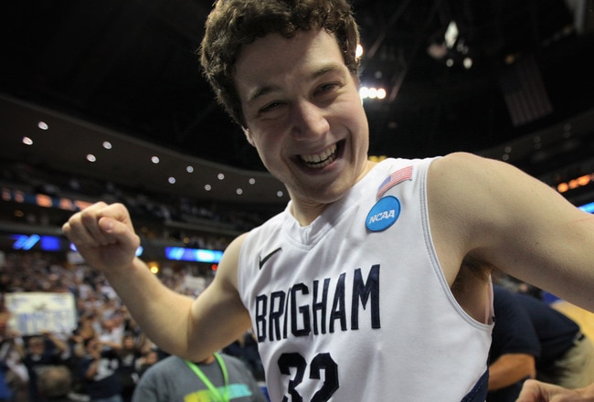 DENVER, CO - MARCH 19:  Jimmer Fredette #32 of the Brigham Young Cougars walks off of the court after defeating the Gonzaga Bulldogs during the third round of the 2011 NCAA men's basketball tournament at Pepsi Center on March 19, 2011 in Denver, Colorado.